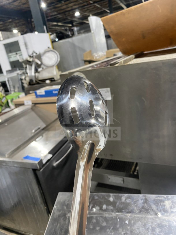 Brand new Winco Prime Series stainless steel perforated buffet spoon, commercial grade, shiny finish, excellent condition.