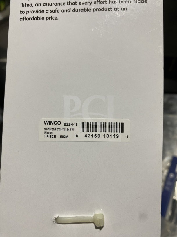 Brand new Winco Prime Series stainless steel perforated serving spoon, model BSSN-18, made in India, with tag and barcode.