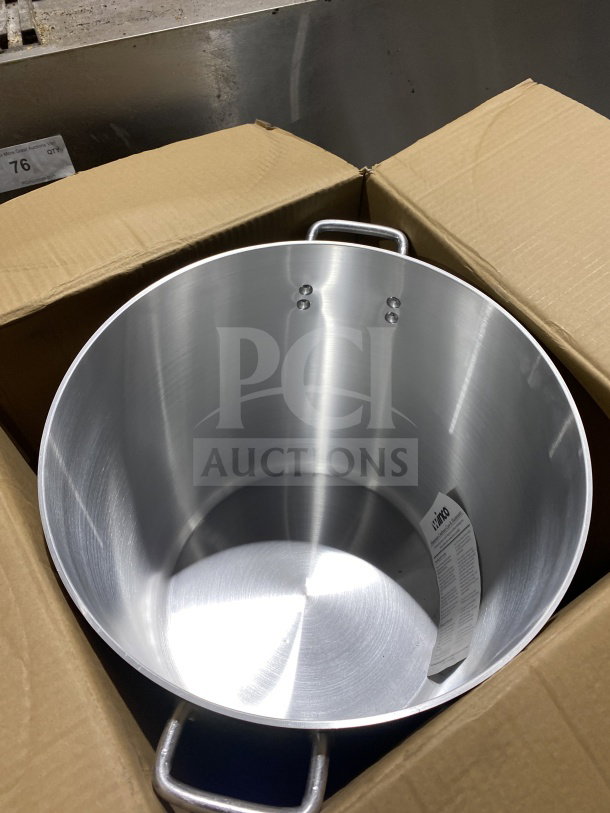 BRAND NEW Winco ALST-60 60Qt elemental aluminum stockpot with dual handles, shown inside original packaging.