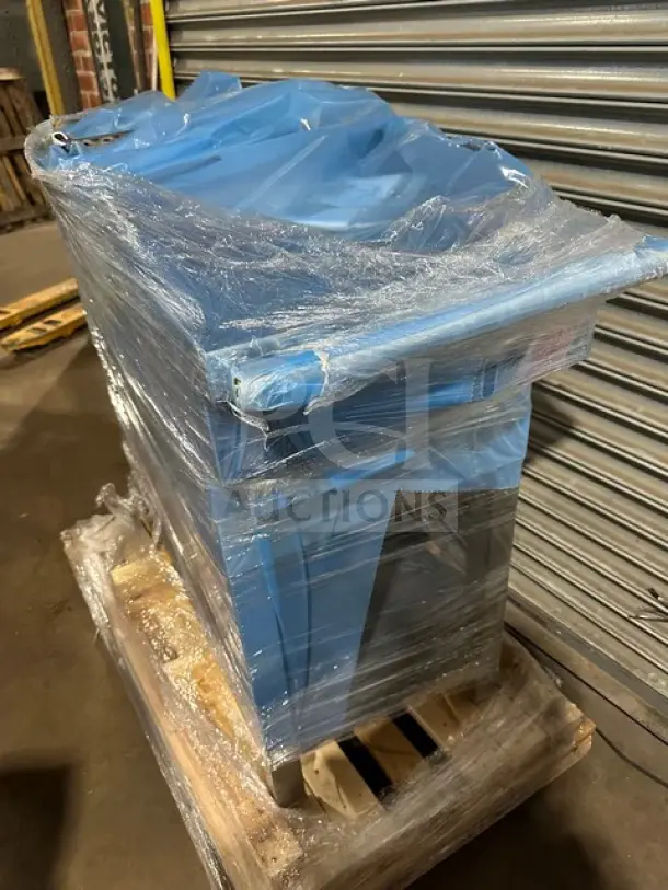 Garland C18-1M-5001 heavy-duty commercial 18" gas range griddle on legs, 30000 BTU, new condition with minor scratches, wrapped on a pallet.