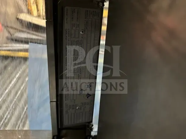 Garland Model C18-1M-5001 gas range griddle, 18-inch, 30000 BTU, heavy-duty, scratch-n-dent condition, on legs.