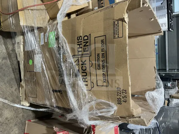 Large box filled with new dishware, cups, and poly bowls. Box is open with visible wrapping, showing labels and handling instructions.
