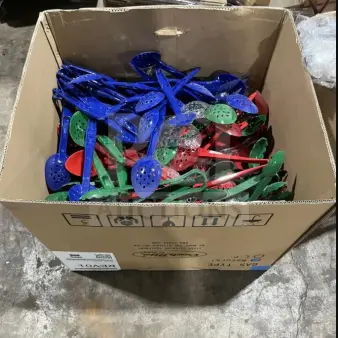 New assorted poly serving spoons and tongs in multi colors, boxed. Includes blue, red, and green pieces.