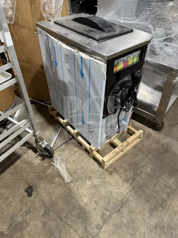 Crathco MPLED commercial frozen beverage machine, stainless steel, electric, 115V, new condition, on pallet.