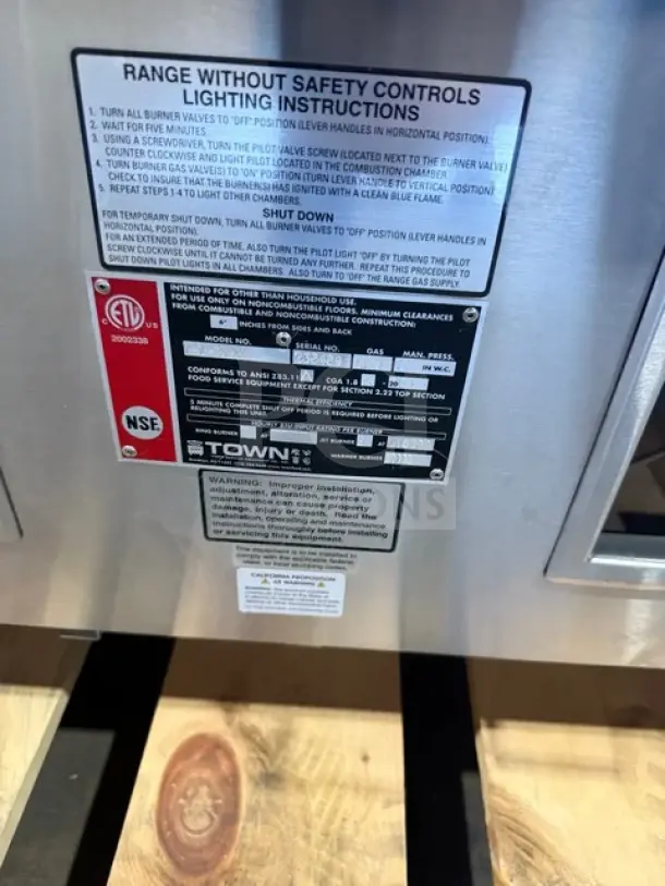 Towns stainless steel 3-station natural gas jet burner wok range, model Y2SSN, new condition, ETL and NSF certified.