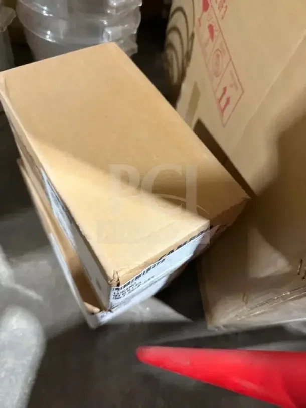 Cambro 9" scallop tongs, Model 9TGS135, new in box. Case of 12. Boxes stacked on floor, labels on side visible.
