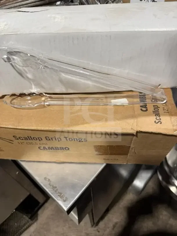 New in box Cambro 9" Scallop Tongs, Model 9TGS135, clear plastic, 12 pieces per case, durable, multipurpose.