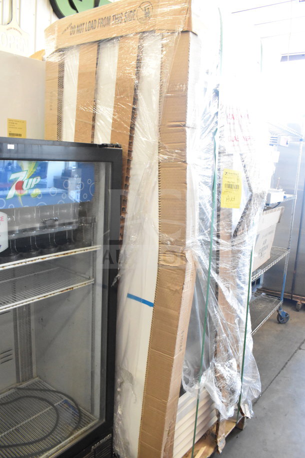 Brand new True TSCI-600R-G-PH cooler merchandiser, partially unpacked, shows minor dents. 115V, single-phase.