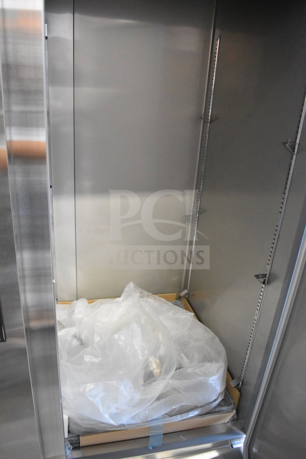 2025 KoolMore RIF-2D-SS commercial freezer, 2 doors, scratch and dent, new condition, 115 volts, 1 phase, interior view.