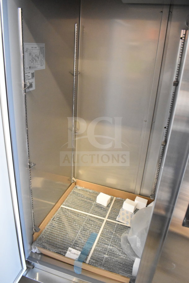 Brand new 2025 KoolMore RIF-2D-SS Commercial 2 Door Reach In Freezer, 115V, 1 Phase, interior view, shelf inserts visible.