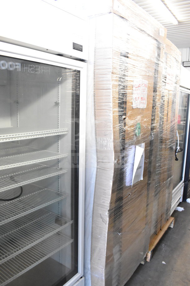 Brand new True TSCI-600R-G-PH single door cooler, 115V, commercial scratch and dent model, wrapped for shipping.