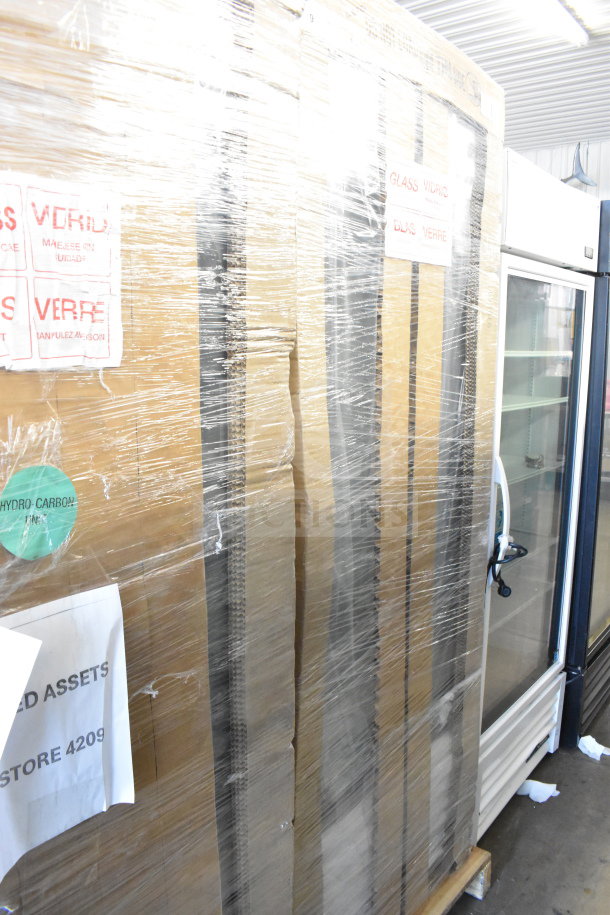 Brand new scratch and dent True TSCI-600R-G-PH commercial cooler, single door, 115 volts, wrapped for transit.
