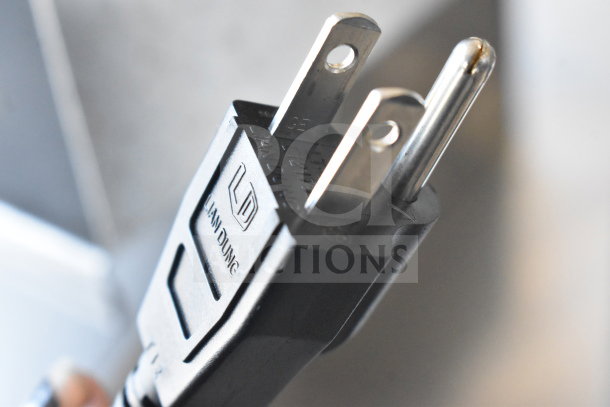 "Brand new Mahlkonig E80W espresso grinder, 110-127V, 1 Phase. Scratch and dent condition. Close-up of power plug."