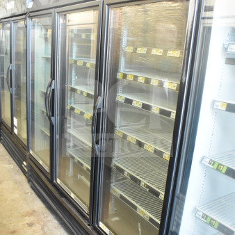 2016 True GDM-72-HC commercial 3-door reach-in cooler. Includes glass doors, shelving, and "Fresh Foods" signage. 115V, 1 phase.