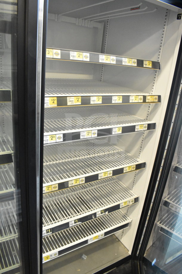 2016 True GDM-72-HC commercial 3-door reach-in cooler, 115 volts, 1 phase. Excellent shelving, minor wear visible.