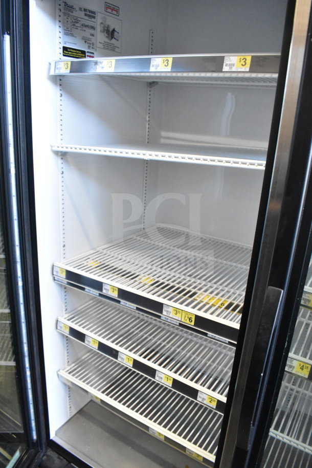 2016 True GDM-72-HC commercial 3-door cooler merchandiser, excellent condition, visible product labels, 115V, 1 phase.