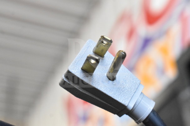 Close-up of a power plug for the 2016 True GDM-72-HC Commercial 3 Door Reach In Cooler Merchandiser, 115 Volts, 1 Phase.