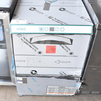 Brand new Noble 495LTUC24 low-temp undercounter dishwasher, 120V, 1 phase, visible scratches and dents, factory labeling intact.