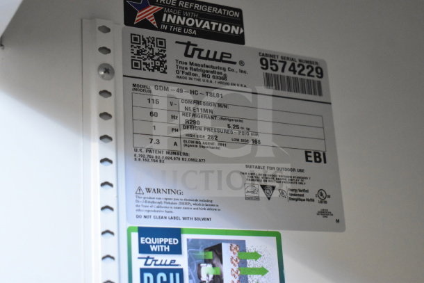 2018 True GDM-49-HC commercial cooler label showing model, voltage, refrigerant, and certification details.