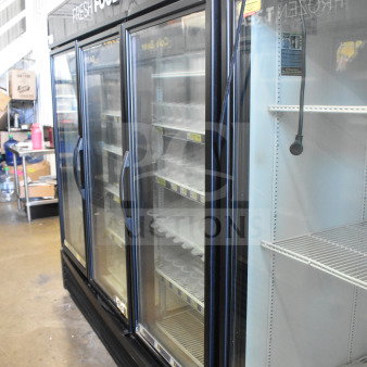 2016 True GDM-72-HC commercial cooler, 3 glass doors, reach-in, 115 volts, used condition, shelves inside, model label visible.