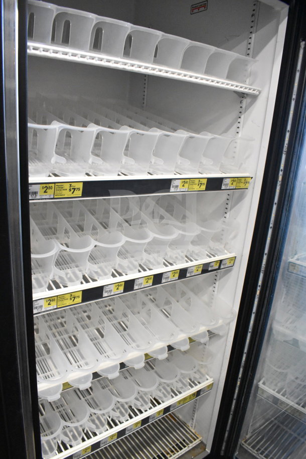 2016 True GDM-72-HC Commercial 3 Door Cooler, 115V, good condition, multiple shelves, price labels visible.