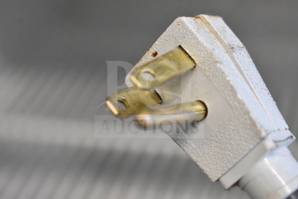 Close-up of a plug from a 2016 True GDM-72-HC commercial cooler, showing three-prong design for 115 volts, 1 phase.