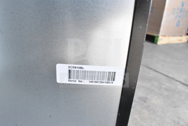 Summit SCR610BL Beverage Center label showing model and serial number 1401601254100013 on silver metallic surface.