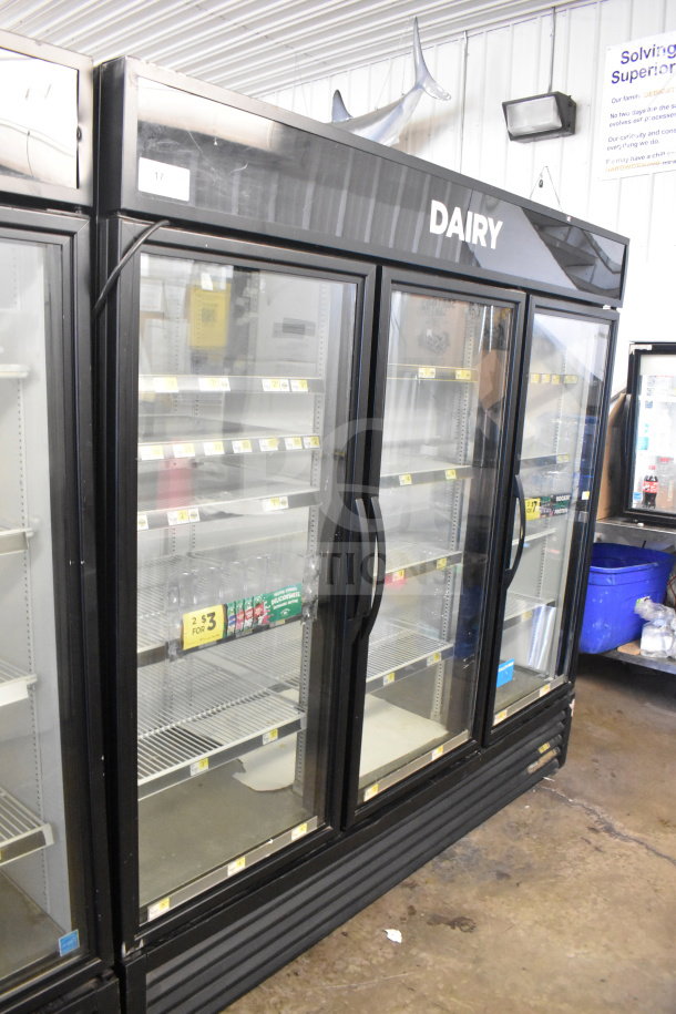 2016 True GDM-72-HC 3 Door Commercial Cooler Merchandiser, 115V, 1 Phase, glass doors, labeled "Dairy," used condition.