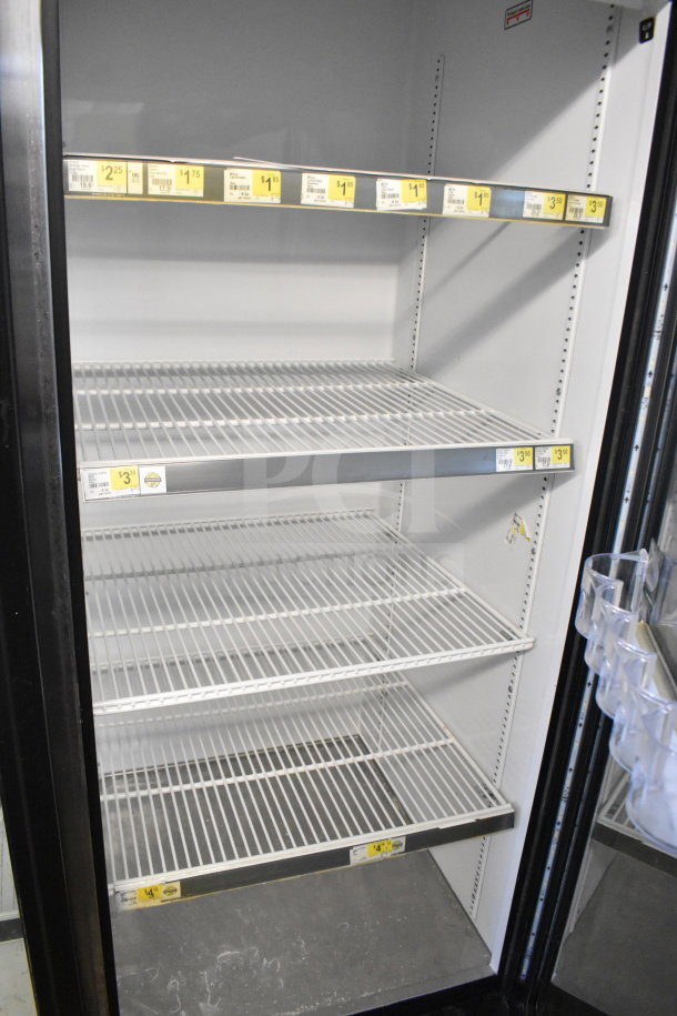 2016 True GDM-72-HC commercial 3-door reach-in cooler with adjustable shelves, price tags, 115 volts, 1 phase, excellent condition.
