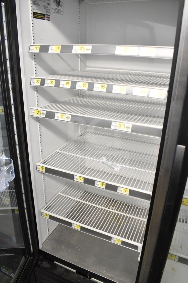 2016 True GDM-72-HC commercial cooler, 3 glass doors, multiple shelves, 115 volts, 1 phase, in good condition.