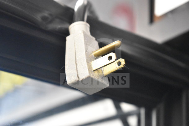 Alt text: Close-up of the power plug of a 2016 True GDM-72-HC Commercial 3 Door Reach In Cooler Merchandiser, 115 Volts.