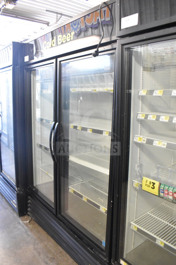 2019 True GDM-49-HC commercial cooler, two glass doors, black frame. Features adjustable shelves, operates on 115V, 1 phase.