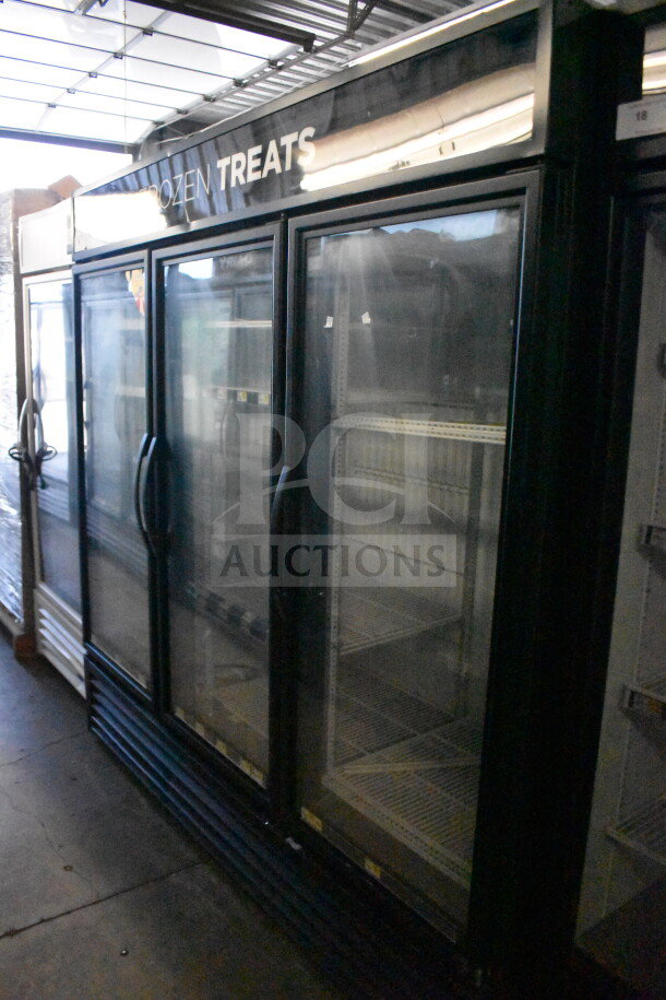 2016 True GDM-72F-HC Commercial 3 Door Freezer Merchandiser, glass doors, black exterior, labeled "Frozen Treats."