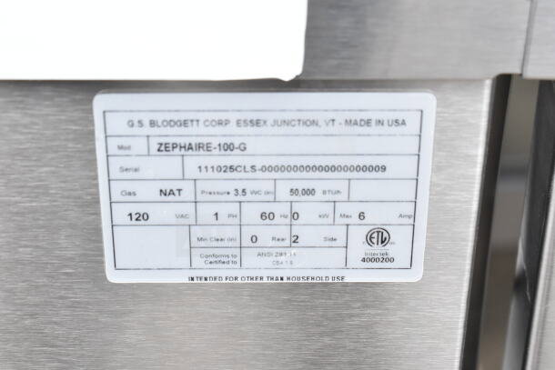 Label on Blodgett Zephaire-100-G oven showing model, 50,000 BTU, and natural gas details. Made in USA.