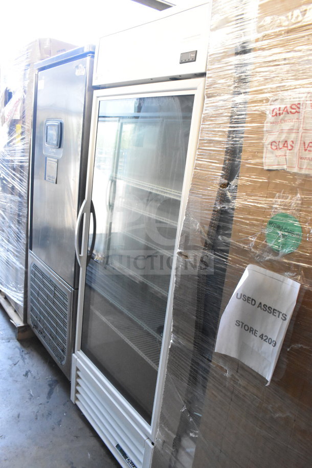 2021 True TSCI-600R-G-PH cooler merchandiser, glass door, 115 volts, good condition, labeled "Used Assets Store 4209."