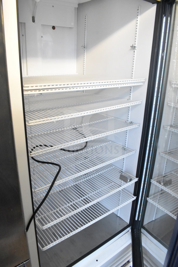 2021 True TSCI-600R-G-PH single door reach-in cooler, 115V, 1 phase, glass door, adjustable shelves, excellent condition.