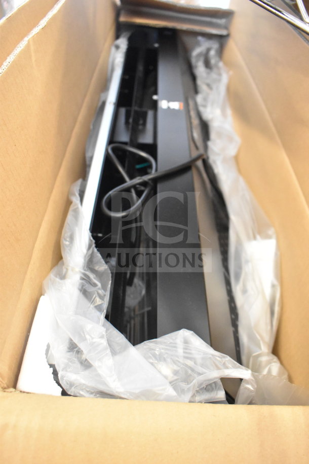 Brand new Boltic 36" black powder coat air curtain, model 6871509BPC, with plunger door switch. Slight dents visible.