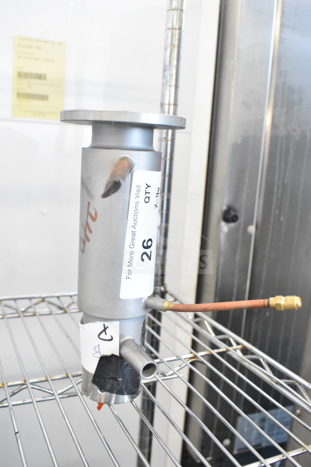 Avantco Ice 19430323 Evaporator Cylinder, brand new, with visible label and markings, displayed on a metal shelf.
