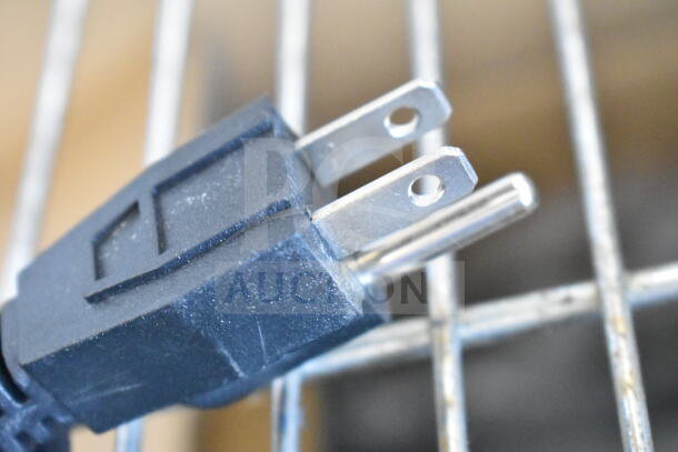 Close-up of a power plug for a 2025 Avantco 177FFDS2 freestanding French fry warmer, showing standard prongs.