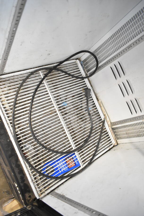2022 Habco ESM12 single door reach-in cooler with interior shelving and power cord, 115 volts, 1 phase, shows wear.