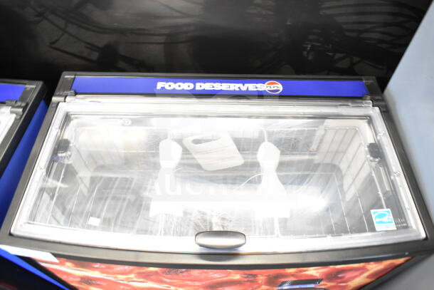 2022 IDW G-60e-NA34B Commercial Impulse Cooler Merchandiser, top view with clear lid, Pepsi branding, and energy sticker.