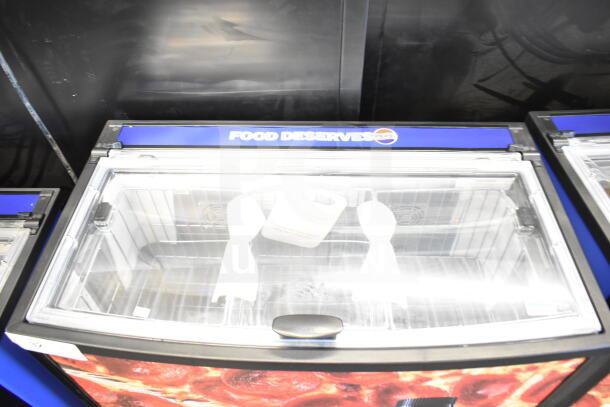 2022 IDW G-60e-NA34B commercial impulse cooler merchandiser, glass lid, visible Pepsi branding, 110-120 volts, 1 phase.