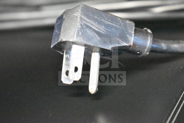 Close-up of the power plug for the 2022 IDW G-60e-NA34B Commercial Impulse Cooler Merchandiser, 110-120 Volts.