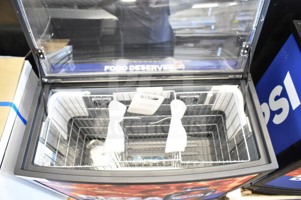 2022 IDW G-60e-NA34B commercial impulse cooler, 110-120V, open lid showing wire baskets and Pepsi branding on the lid.