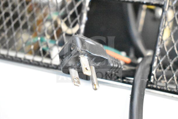 Central 69K-034 commercial freezer plug, 115V, 1 phase, metal mesh background.