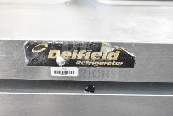 Delfield Commercial Sandwich Salad Prep Table with Bain Marie Mega Top. Tag reads "Delfield Refrigerator." Missing lid bolts. 115 volts, 1 phase.