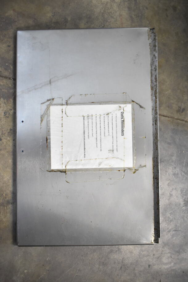 Delfield Commercial Prep Table lid, stainless steel surface, missing bolts for bain marie setup, includes daily reminders sheet.