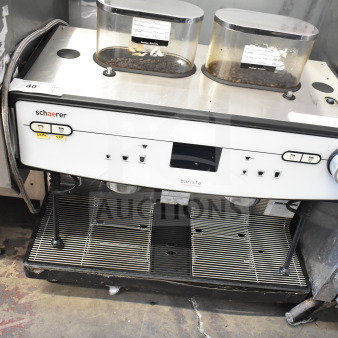 Schaerer Barista commercial espresso machine with 2 groups, 2 hoppers, and 2 steam wands, in used condition.