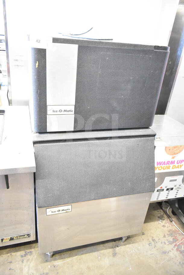 Ice-O-Matic ICE0400HWI ice machine head with B40PSA bin. 115V, 1 phase. Features stainless steel finish, commercial condition.