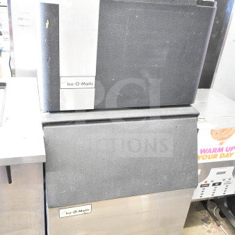 Ice-O-Matic ICE0400HWI ice machine head with B40PSA bin. 115V, 1 phase. Features stainless steel finish, commercial condition.